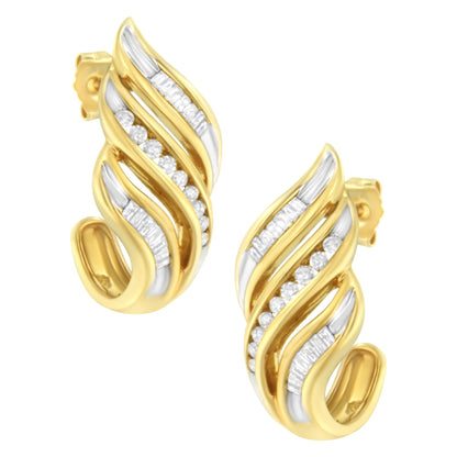 Close-up front angle of yellow metal earrings featuring alternating rows of round and baguette white gemstones in a channel setting.