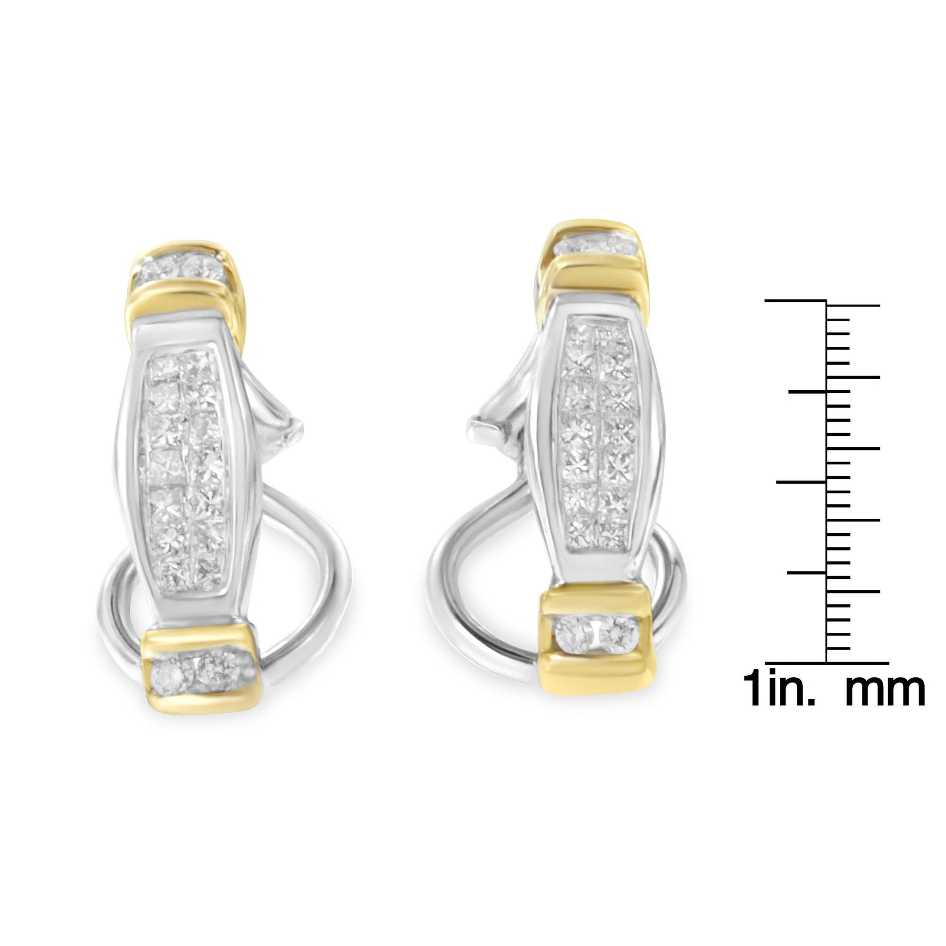 Front-facing shot of two-toned earrings with white round and princess-shaped gemstones in channel settings, shown next to a ruler for size reference.