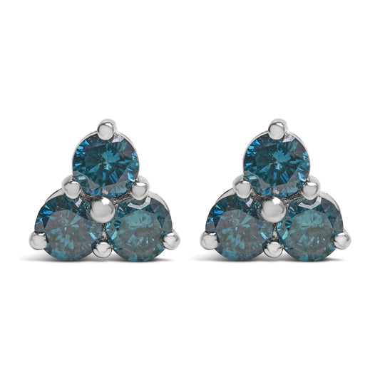 Front view of white metal triangular cluster earrings each with three round blue gemstones in prong settings.