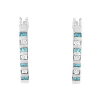 Front view of a pair of white metal earrings with alternating channel-set white round and blue baguette gemstones in a vertical arrangement.