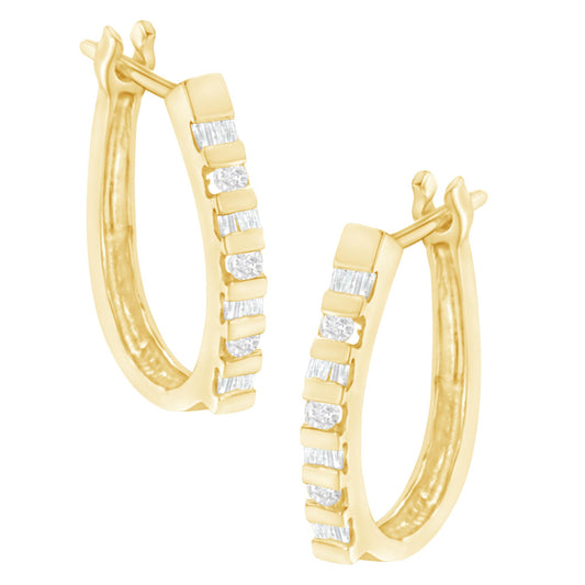 Pair of yellow metal hoop earrings with alternating round and baguette white gemstones in channel settings, shown from a front angle.
