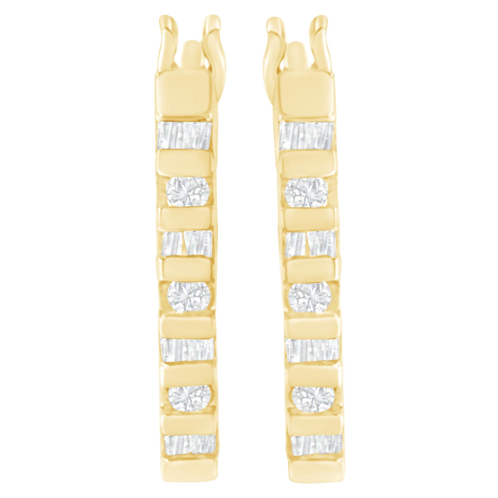Front view of pair of yellow metal earrings with alternating white round and baguette shaped gemstones in channel settings.