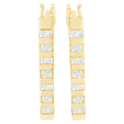 Front view of pair of yellow metal earrings with alternating white round and baguette shaped gemstones in channel settings.