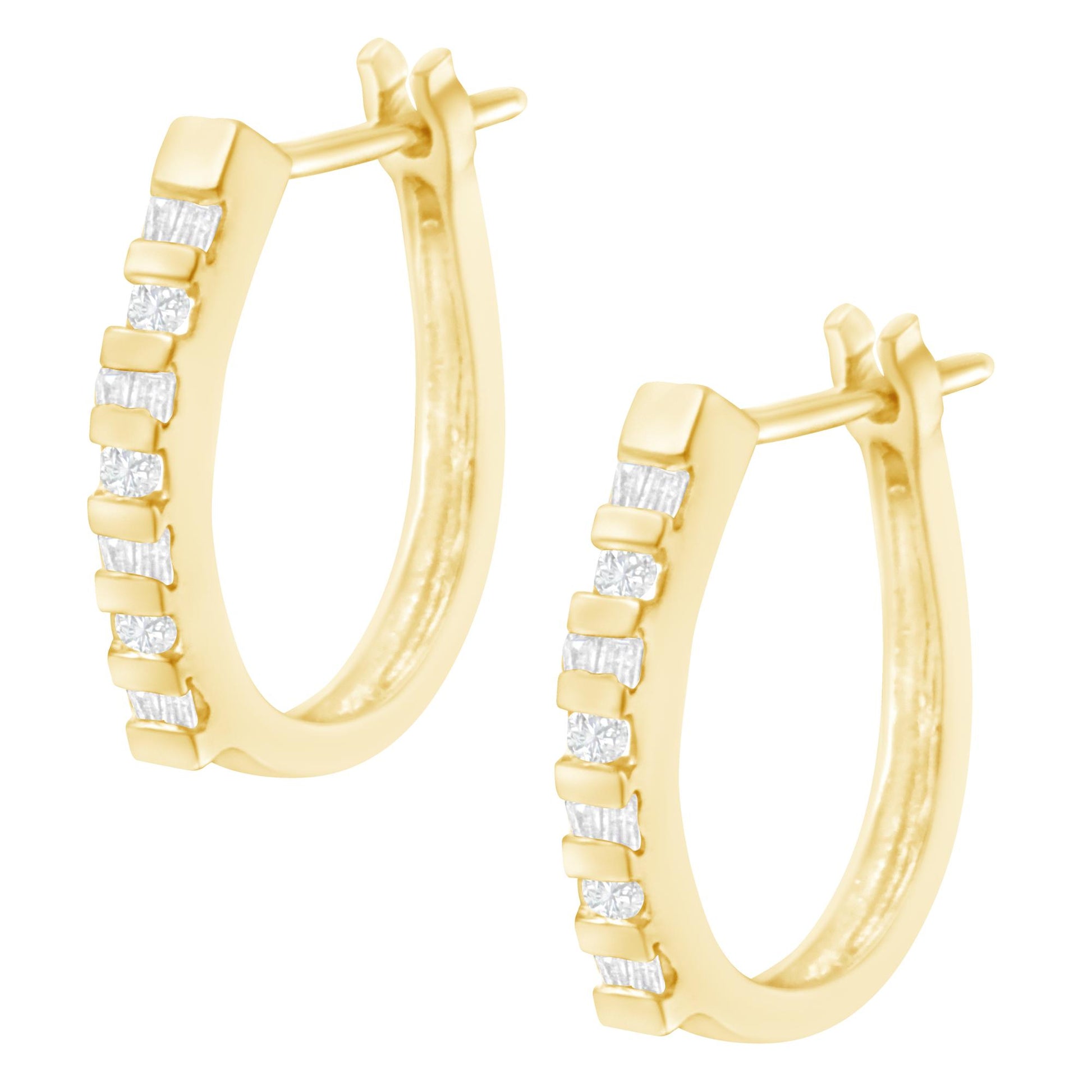 Pair of yellow hoop earrings with alternating round and baguette white gemstones in channel settings, shown in a front diagonal view.