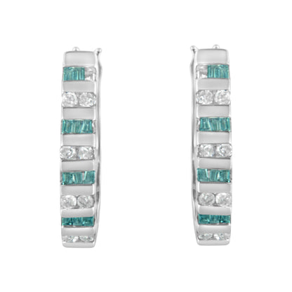 Pair of white metal hoop earrings with alternating channels of round white gemstones and baguette blue gemstones, shown from the front angle.