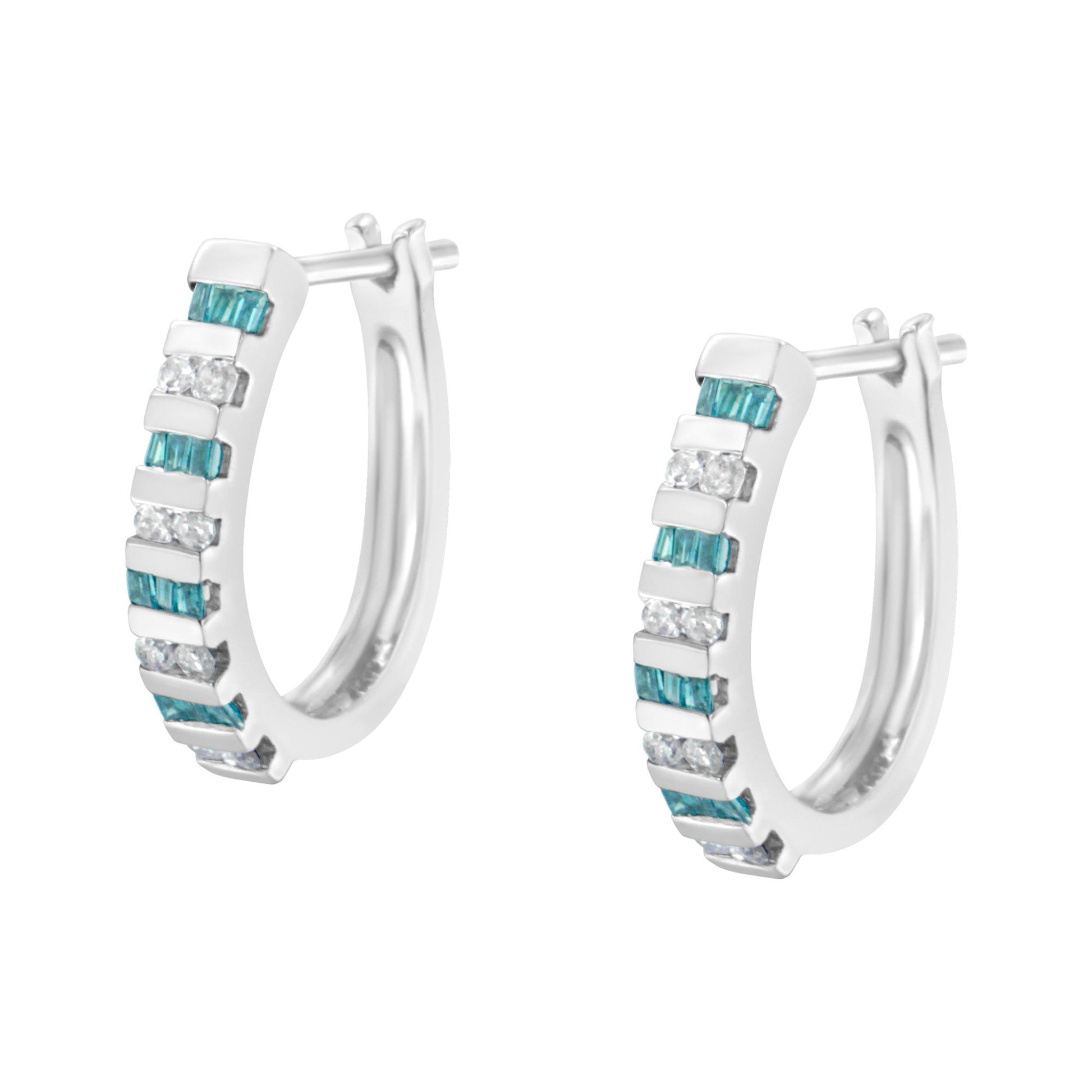 Pair of white metal hoop earrings with alternating rows of channel-set blue baguette-shaped and white round-shaped gemstones, shown from a front angled view.