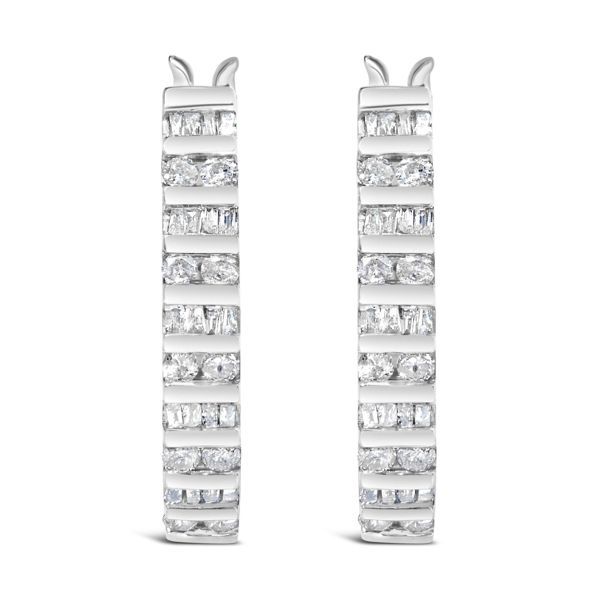 Close-up front view of a pair of white metal hoop earrings featuring alternating channel-set white round and baguette gemstones.