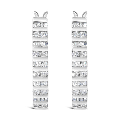 Close-up front view of a pair of white metal hoop earrings featuring alternating channel-set white round and baguette gemstones.