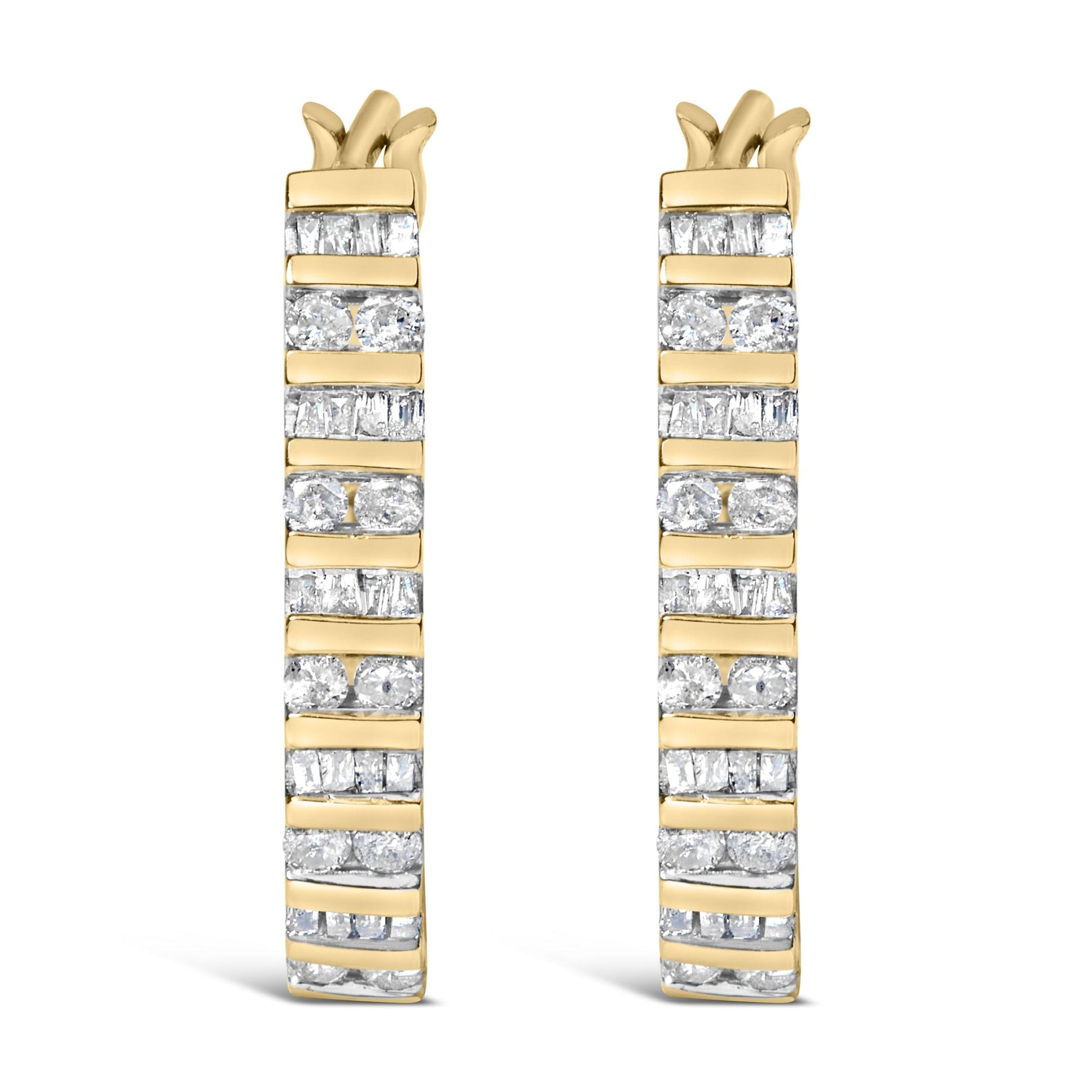 Front-facing close-up of a pair of yellow metal earrings with alternating rows of white round and baguette gemstones in a channel setting.