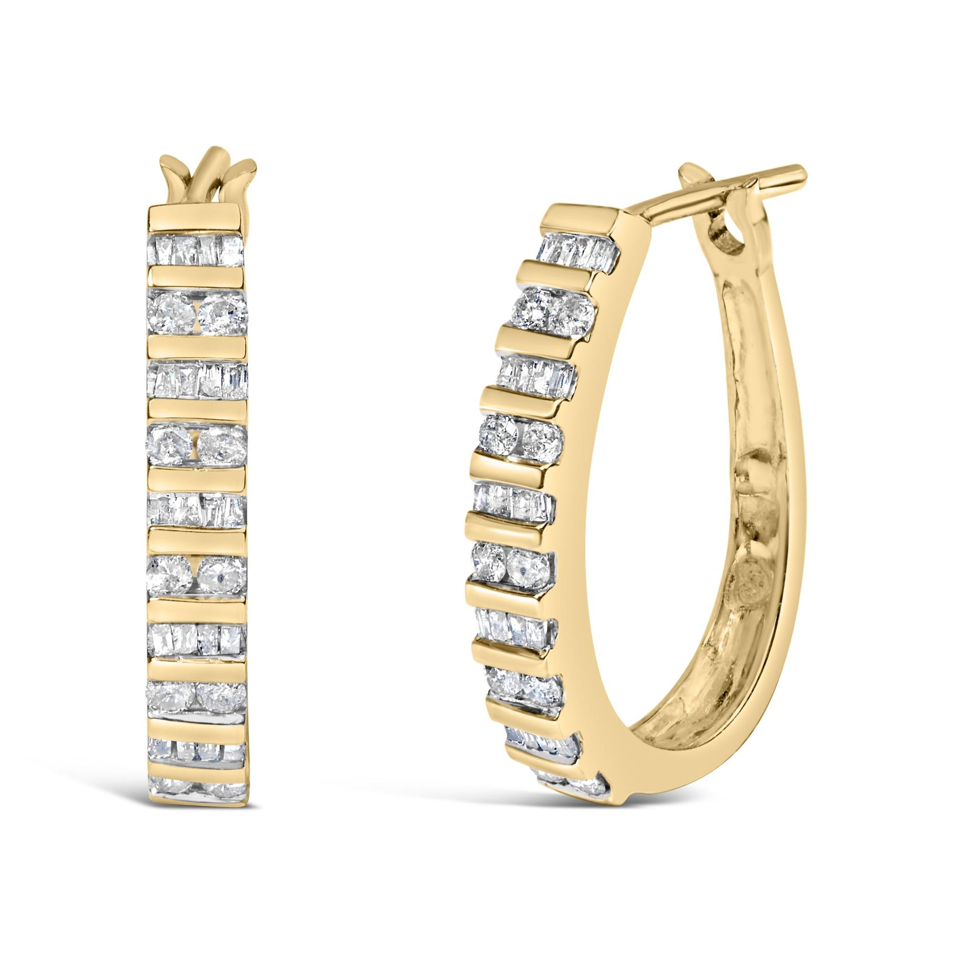 Close-up front and side view of yellow metal hoop earrings set with alternating round and baguette white gemstones in a channel setting.