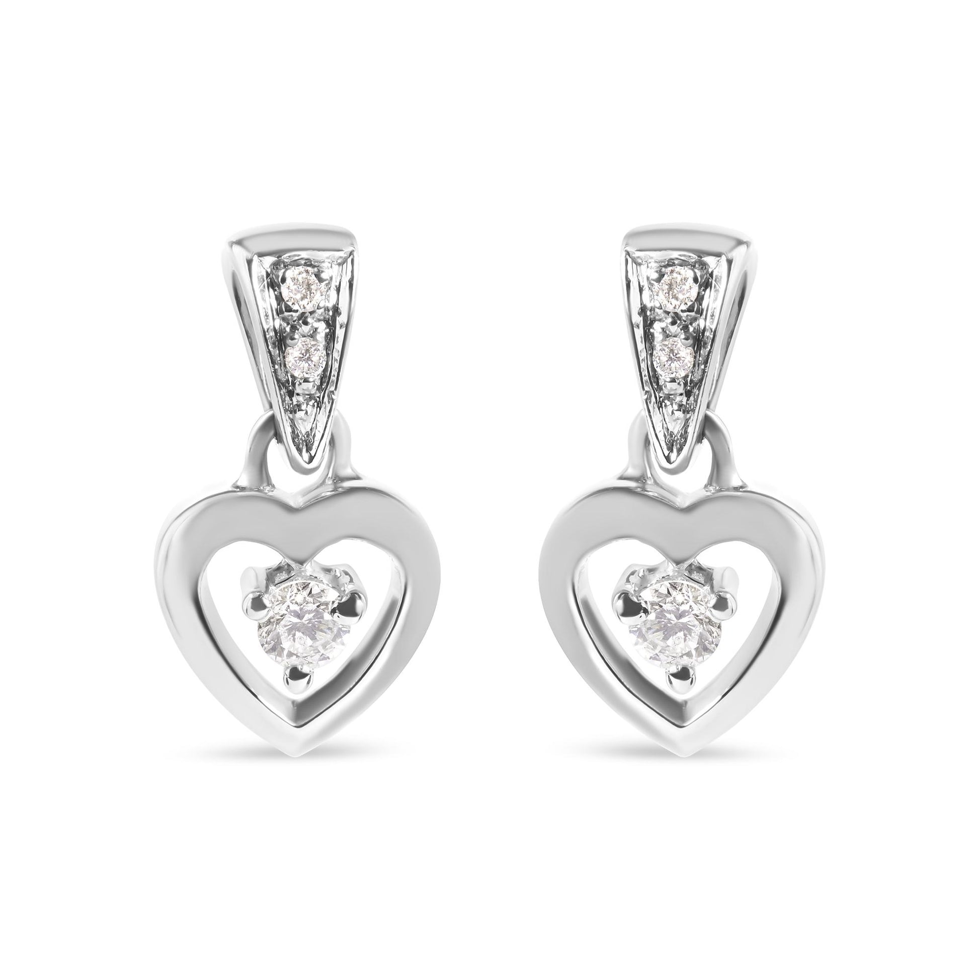 Front view of white metal heart-shaped earrings with prong-set round white gemstones, shown as a pair.