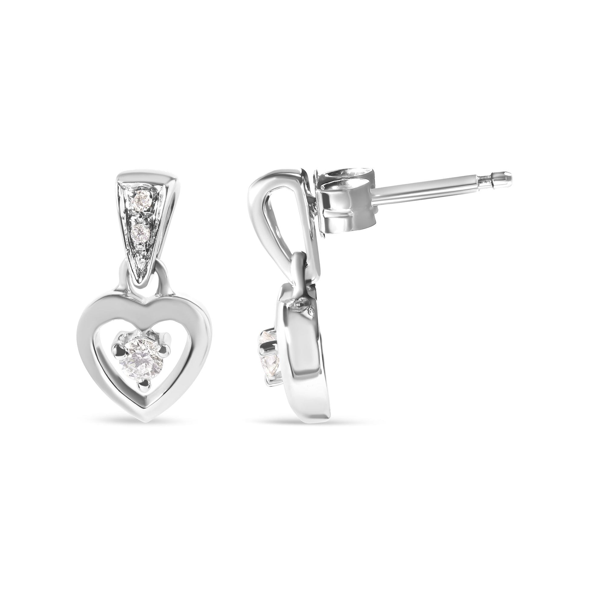 Front and side view of white metal heart-shaped earrings with round white gemstones in prong settings.