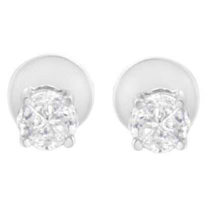 Front angle view of white metal stud earrings with round white gemstones in prong settings.