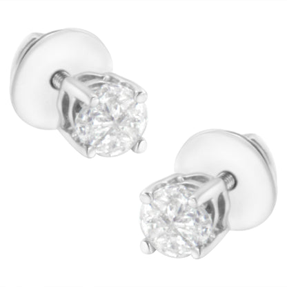 Pair of white metal stud earrings with round white gemstones in prong settings, shown at a slight angle.