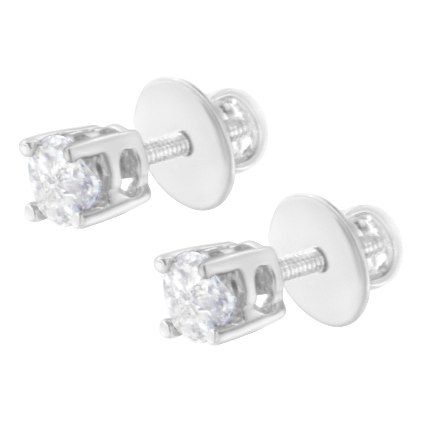 Pair of white metal stud earrings with prong-set white pie-shaped gemstones, shown in close-up angled view.