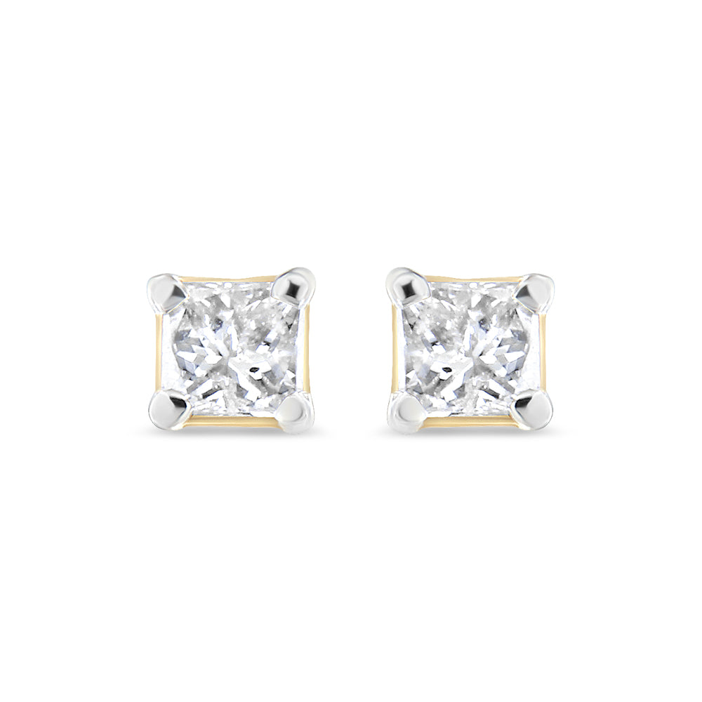 Front angle view of a pair of yellow metal stud earrings with square-shaped white gemstones held by four-prong settings.