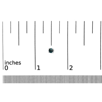 Close-up front view of a white metal round blue gemstone stud earring shown on a scale.