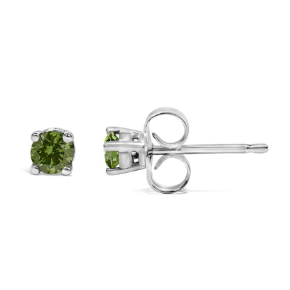 Pair of white metal stud earrings with round green gemstones in prong settings, shown from a side angle.