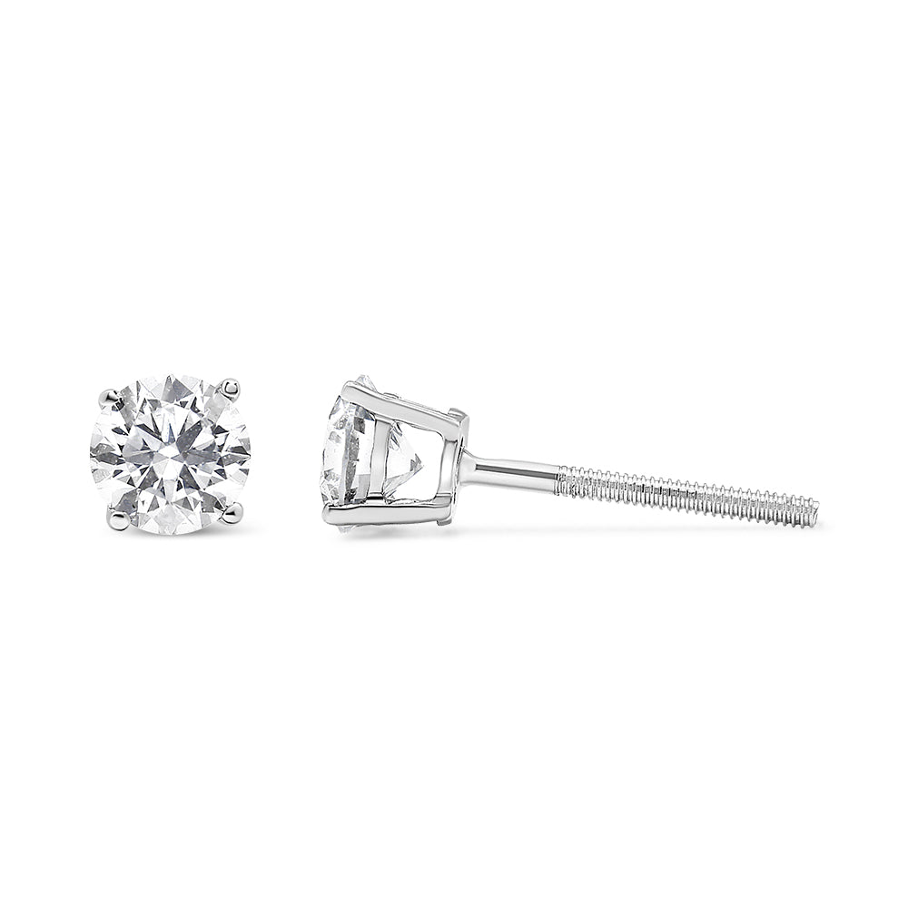 Pair of white metal stud earrings with round white gemstones in prong settings, shown from front and side angle on a white background.