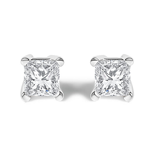 Front view of white metal stud earrings with princess-shaped white gemstones in prong settings.