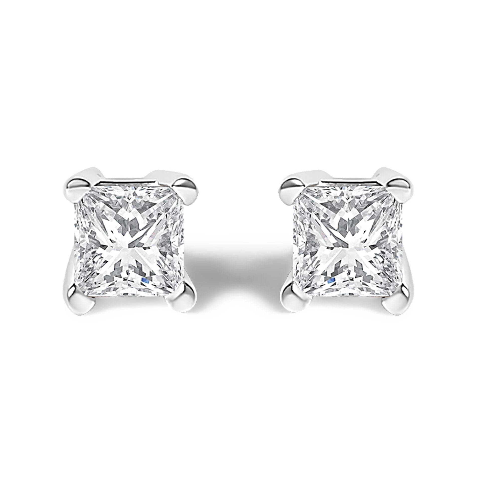 Front view of white metal stud earrings with princess-shaped white gemstones in prong settings.