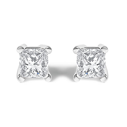 Front view of white metal stud earrings with princess-shaped white gemstones in prong settings.