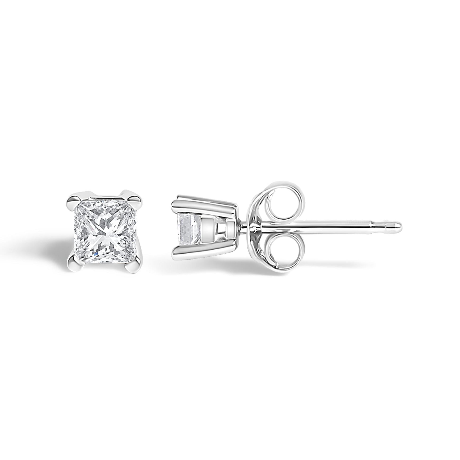 Pair of white metal stud earrings with princess-shaped white gemstones in prong settings, shown from front and side angles on a white background.