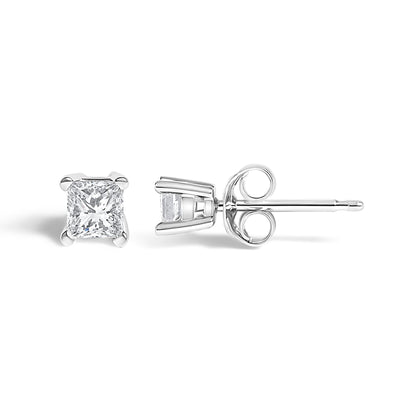 Pair of white metal stud earrings with princess-shaped white gemstones in prong settings, shown from front and side angles on a white background.