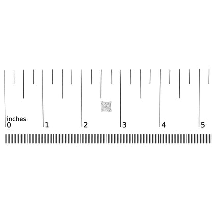 Close-up of white metal princess-shaped gemstone stud earring in a four-prong setting placed on a ruler for size reference.