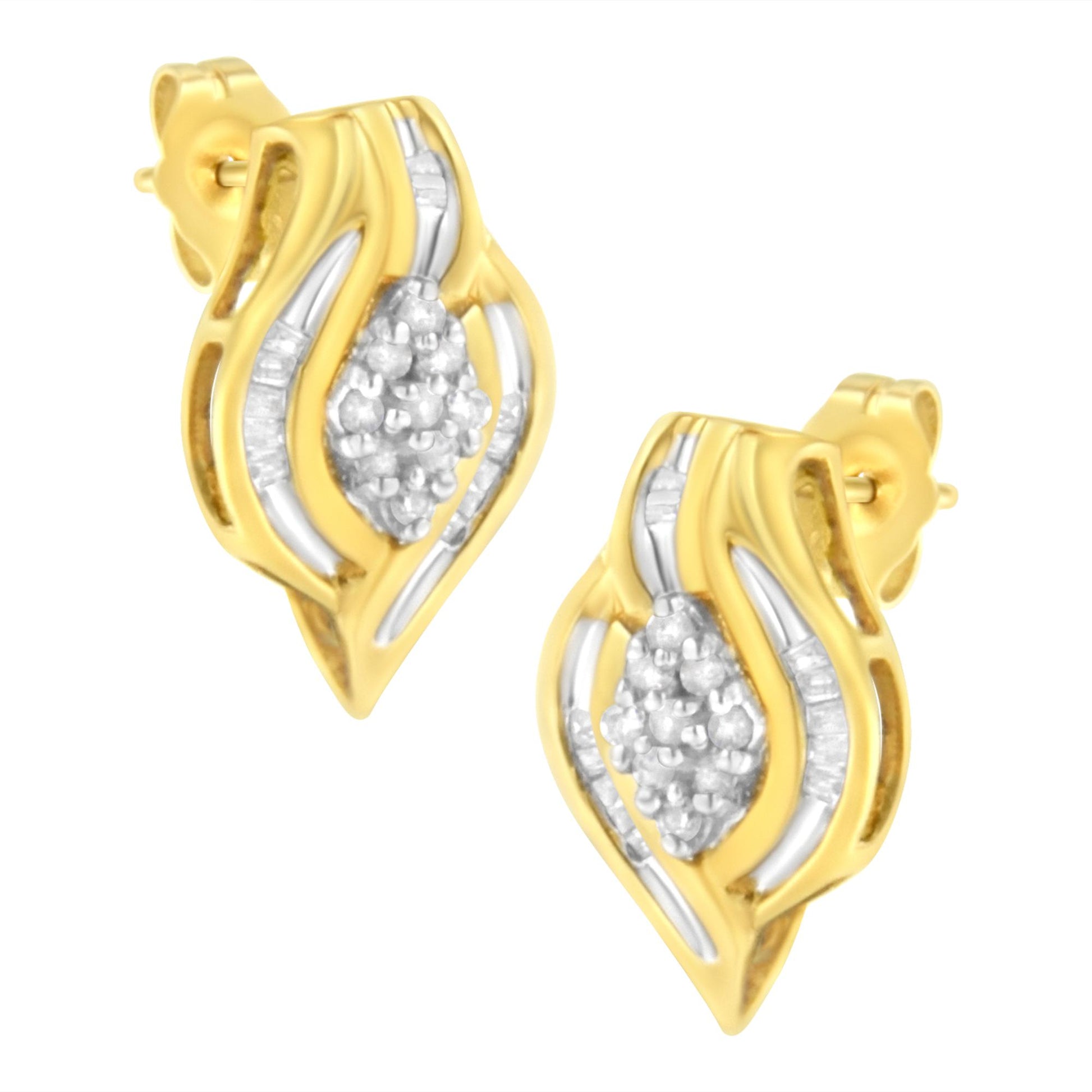 Pair of yellow metal earrings with a wavy design, featuring clustered round white gemstones in prong settings at the center and baguette white gemstones in channel settings along the sides, shown in a front angled view.