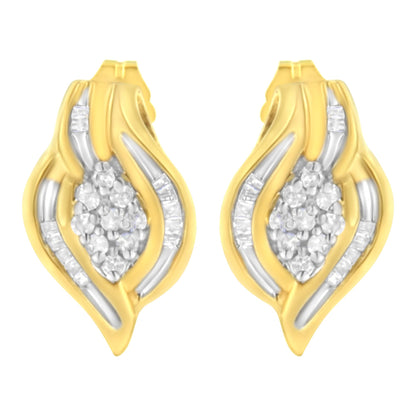 Pair of yellow metal earrings with a leaf-like shape, featuring white round gemstones in prong settings clustered in the center and white baguette gemstones in channel settings along the curves, shown from the front angle.