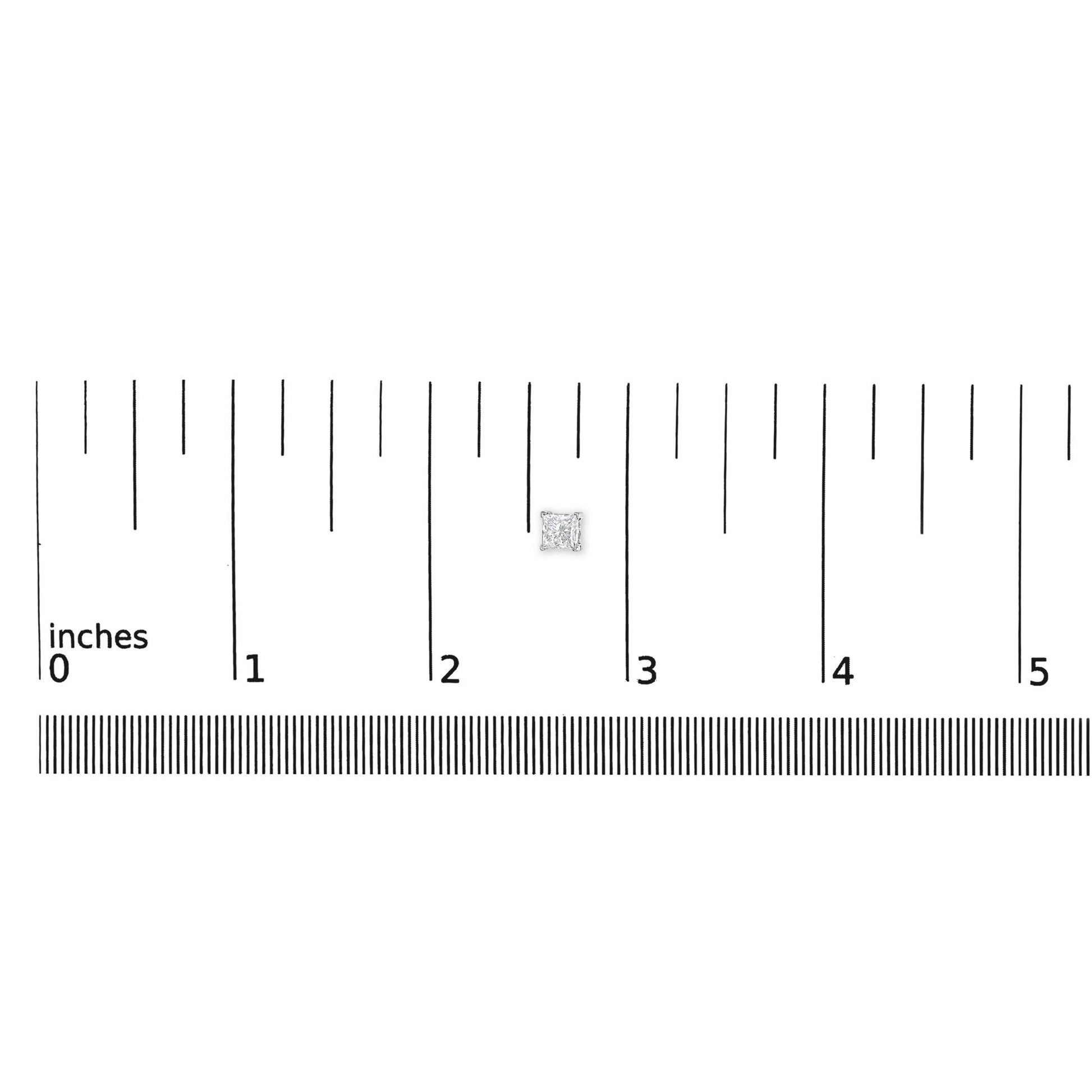Close-up front view of a white metal princess-shaped stud earring with a white gemstone in a four-prong setting, placed on a ruler for size reference.