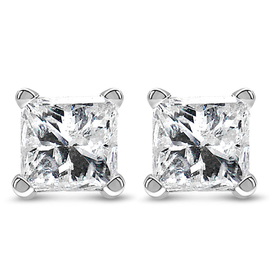 Pair of white metal stud earrings with princess shape white gemstones in four-prong settings, shown in a front-facing close-up shot.