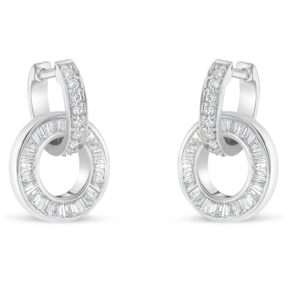 Pair of white metal earrings with a circular hoop design featuring channel-set baguette-shaped white gemstones and a row of prong-set round white gemstones on the top hoop, shown from the front angle.