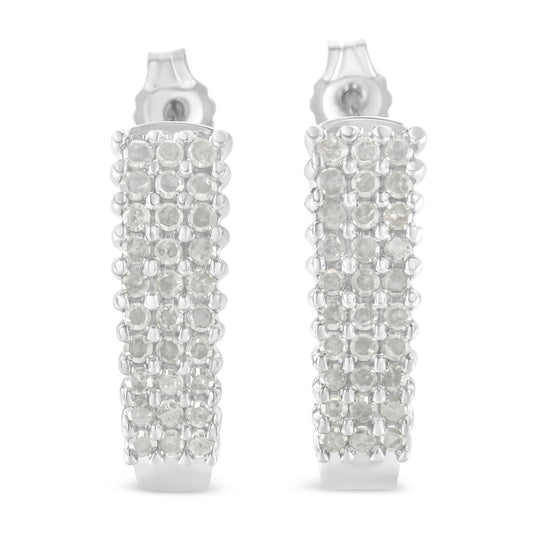 Front-facing close-up of a pair of white metal rectangular earrings set with multiple rows of round white gemstones in prong settings.