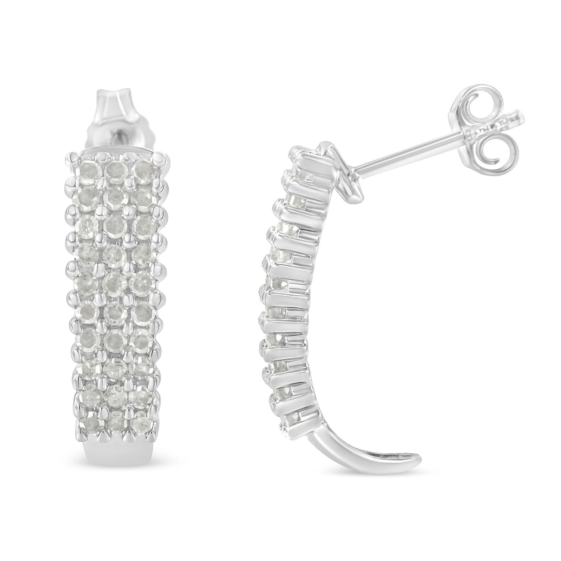 Pair of white metal semi-hoop earrings with multiple rows of round white gemstones in prong settings, shown from front and side angles.