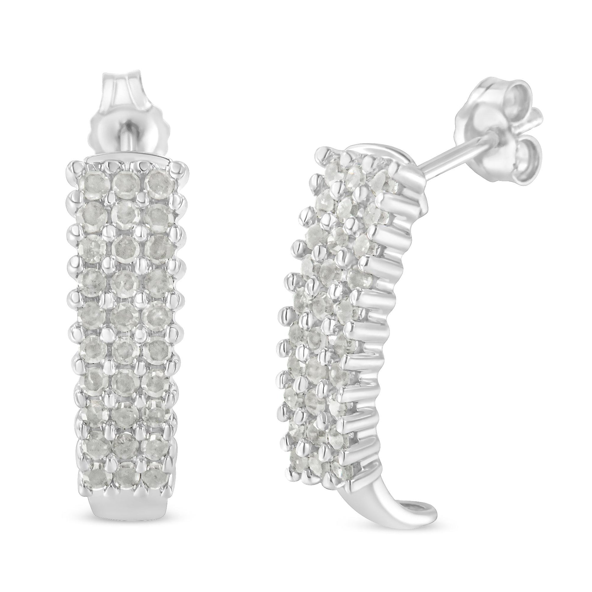 Pair of white metal hoop earrings with multiple round white gemstones in prong settings, shown from front and side angles.