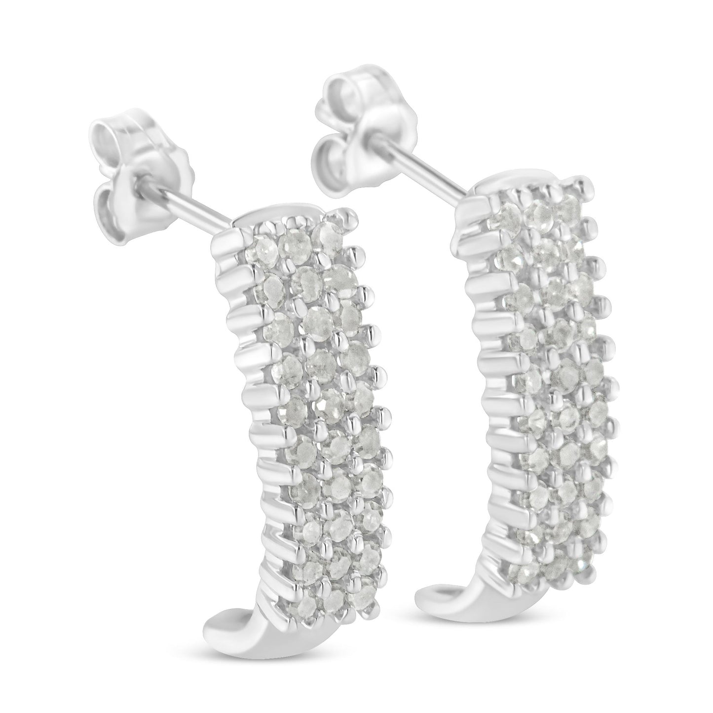 Pair of white metal earrings with rows of round white gemstones in prong settings, shown at a slight angle.