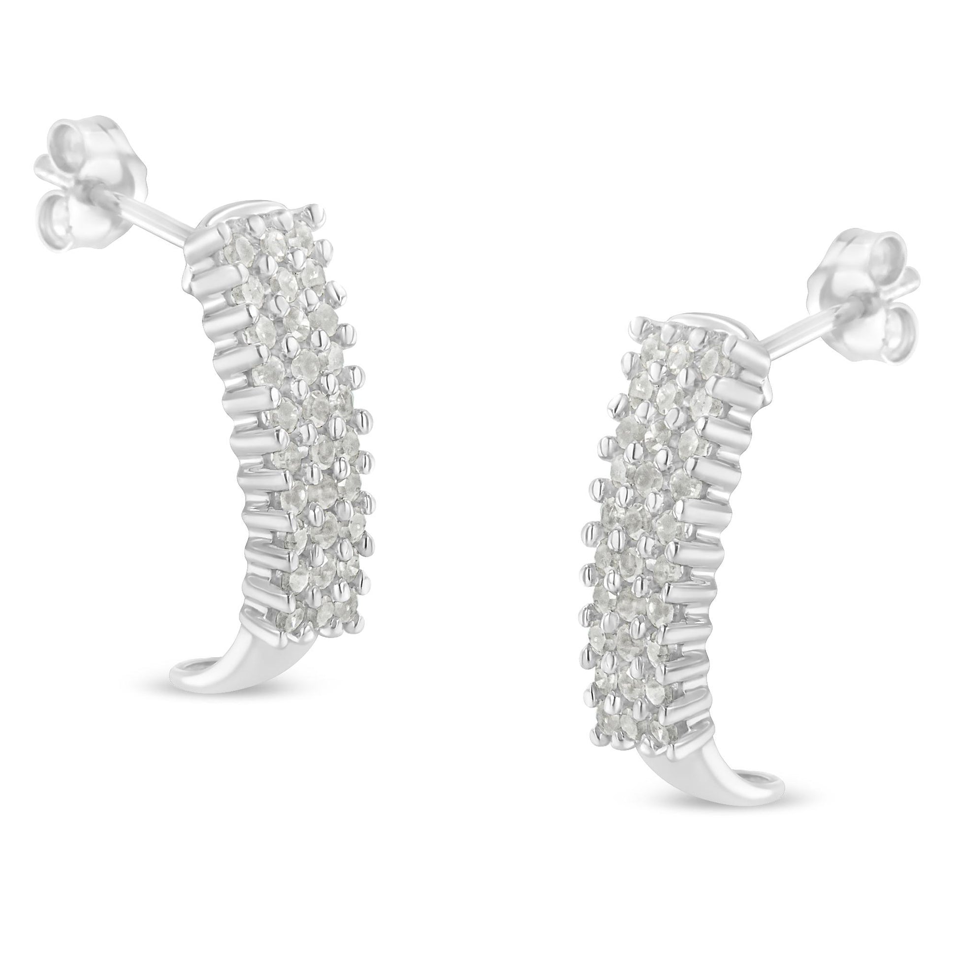 Pair of white curved stud earrings with multiple round white gemstones in prong settings, shown in a close-up front angle.