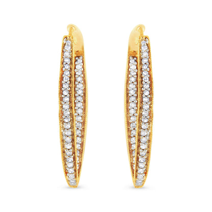 Pair of yellow metal earrings with two rows of prong-set white round gemstones, front-facing angle.