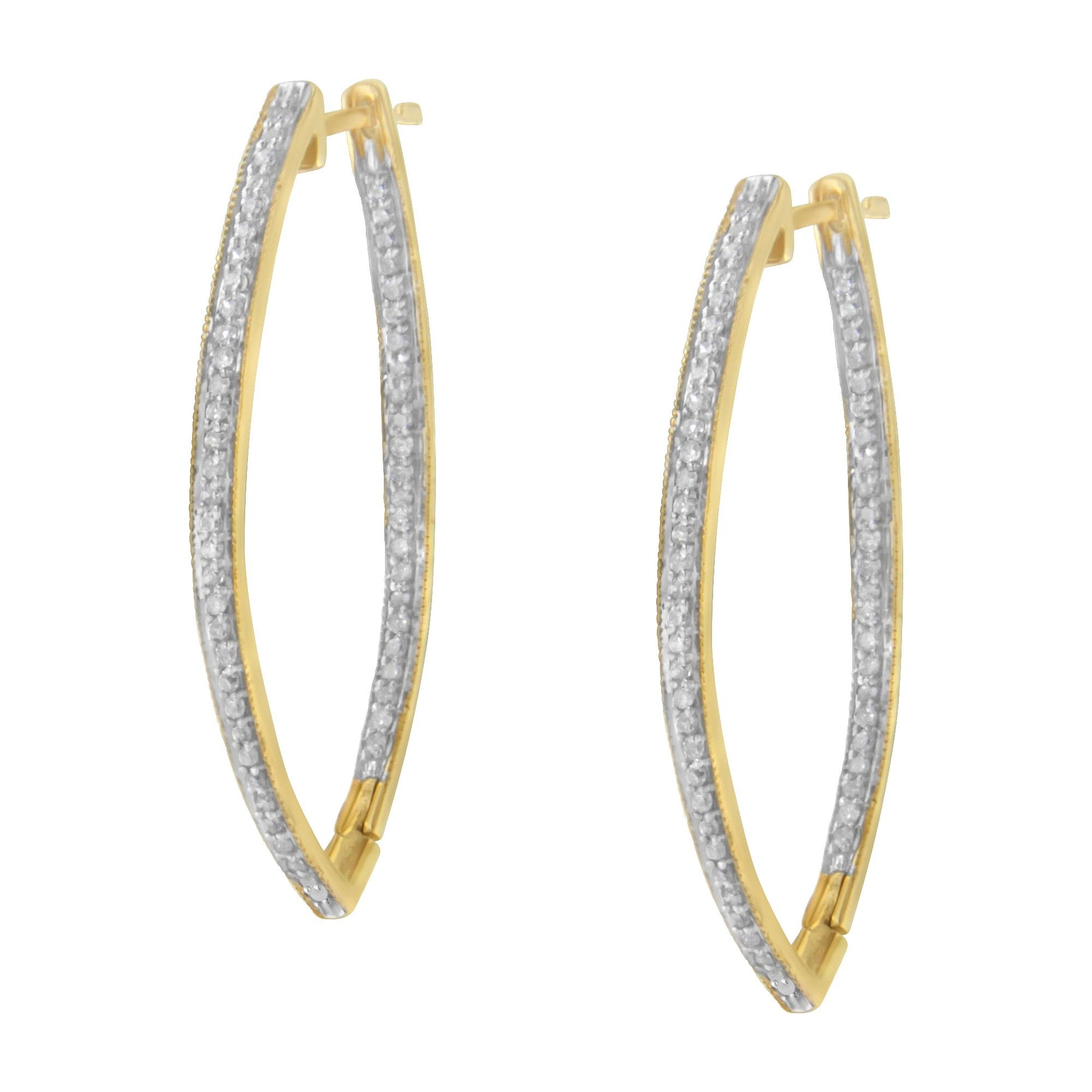 Pair of elongated yellow metal hoop earrings with rows of white round gemstones in prong settings, shown from a front angle.