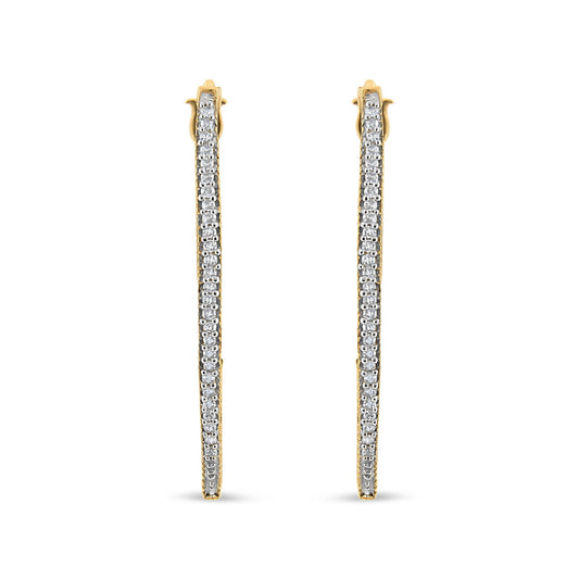 Front-facing view of yellow metal earrings with a single row of round white gemstones in prong setting along the length.