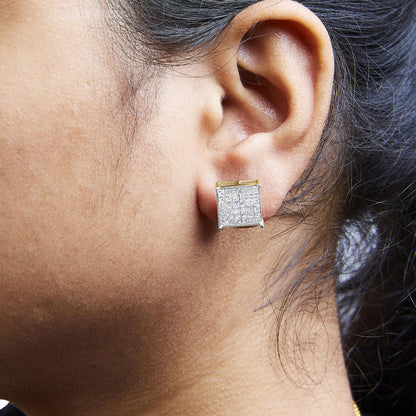 Close-up side view of a model wearing a square-shaped yellow metal earring with prong-set white square gemstones covering the surface.