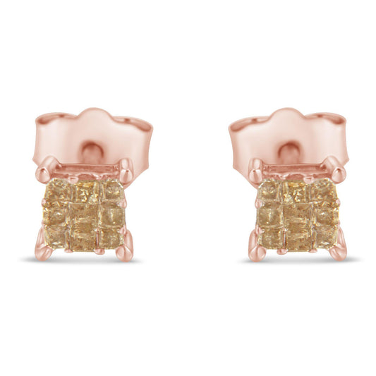 Pair of rose metal stud earrings with square cluster of light-colored gemstones in invisible setting, front view.