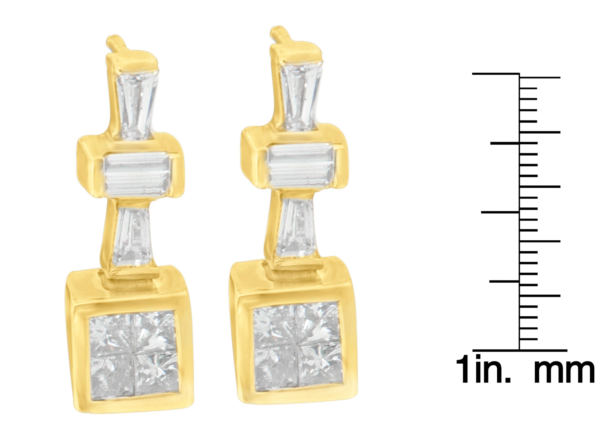 Front-facing view of pair of yellow metal earrings with white gemstones in baguette shape set in channel setting and princess shape in invisible setting, shown next to a ruler for size reference.