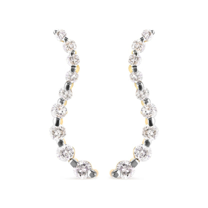 Front view of a pair of yellow metal earrings with a curved design, featuring prong-set white round gemstones.