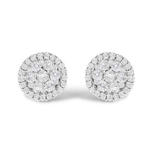 Front-facing view of a pair of white metal round stud earrings, each featuring multiple small white gemstones in shared prong and tension settings forming a clustered circular design.