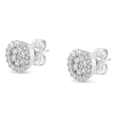 Pair of white metal round stud earrings with prong-set white gemstones, shown from a front angle.