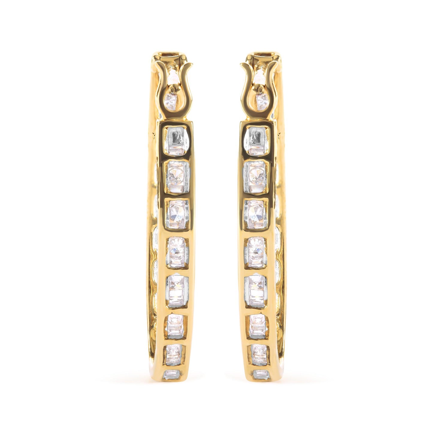 Front view of yellow metal hoop earrings with channel-set white baguette gemstones and prong-set round white gemstones.