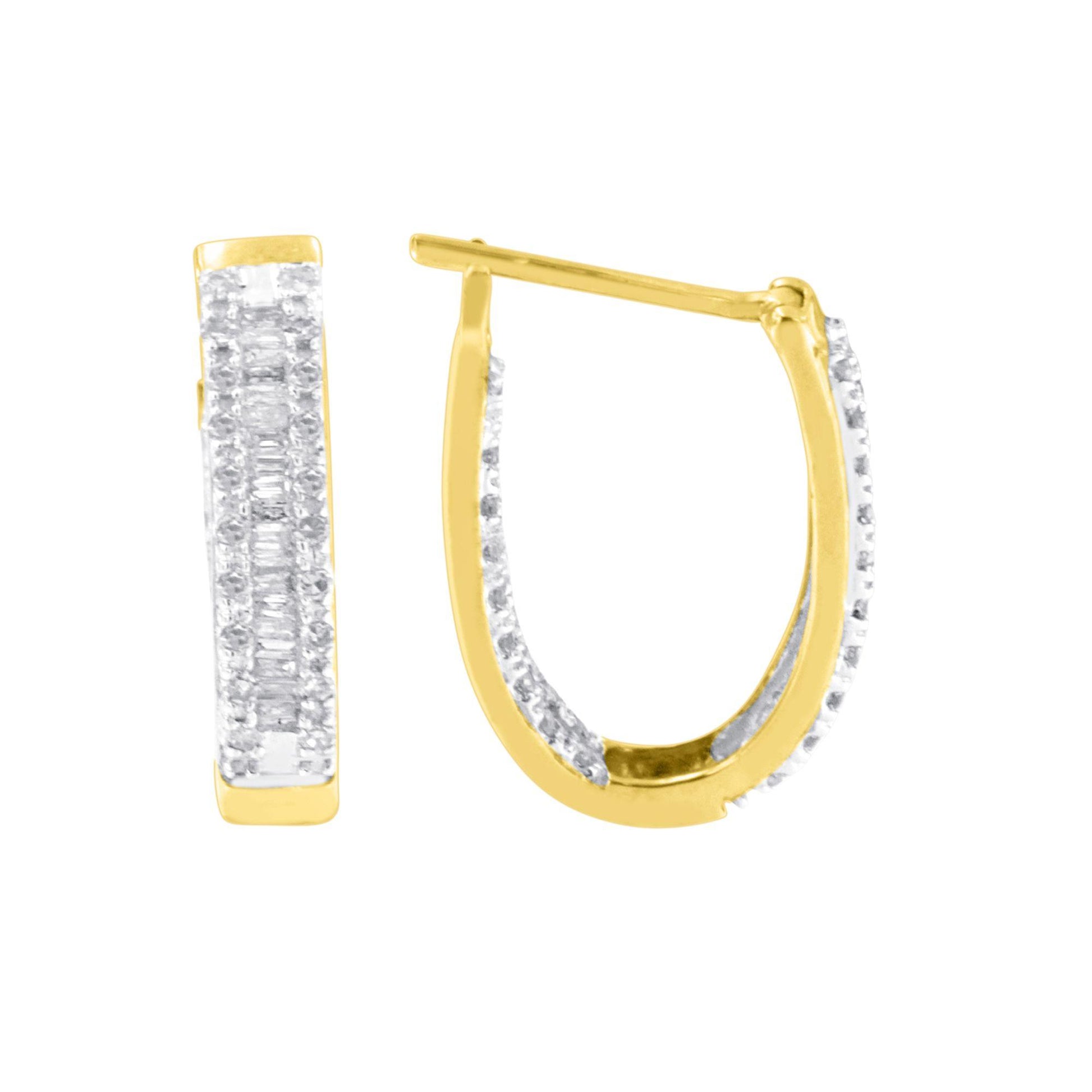 Close-up front and side view of yellow metal hoop earrings with white round and baguette gemstones in prong and channel settings.